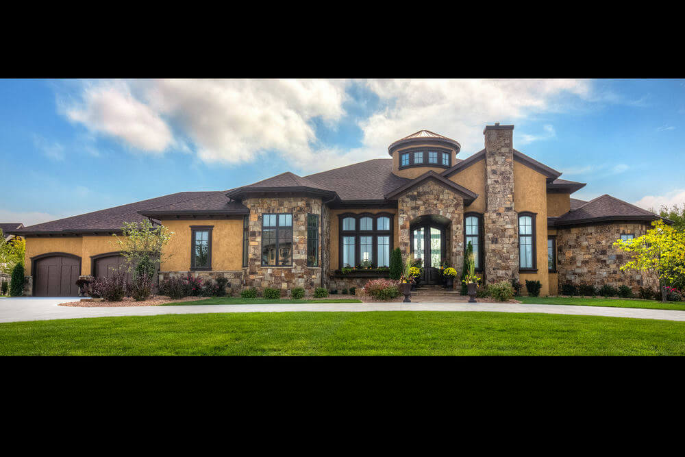 52915LL-front-Tuscan-1-story-house-plans-4-bedroom-5-bath-turret