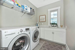    57116-laundry-craftsman-1.5-story-house-plans-3-bedroom-3-bathroom